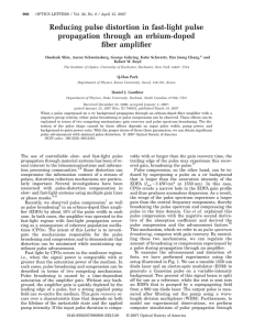 Reducing pulse distortion in fast-light pulse propagation through an erbium-doped fiber amplifier *