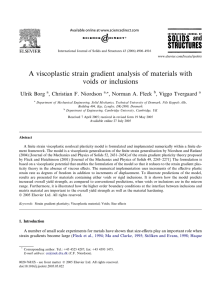 A viscoplastic strain gradient analysis of materials with voids or inclusions