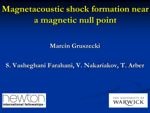 Magnetacoustic shock formation near a magnetic null point Marcin Gruszecki