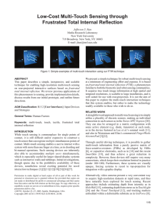 Low-Cost Multi-Touch Sensing through Frustrated Total Internal Reﬂ ection