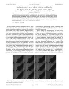 Sonoluminescence from an isolated bubble on a solid surface