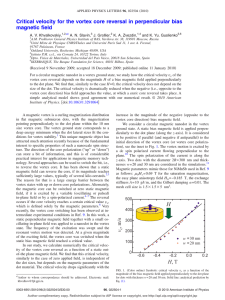 Critical velocity for the vortex core reversal in perpendicular bias