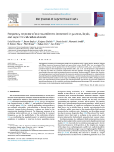 Frequency response of microcantilevers immersed in gaseous