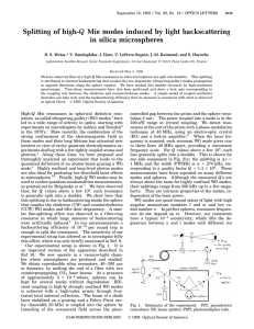 Splitting of high-Q Mie modes induced by light backscattering in